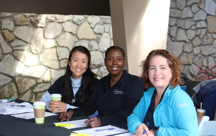 TORC employee volunteers assist with check-in